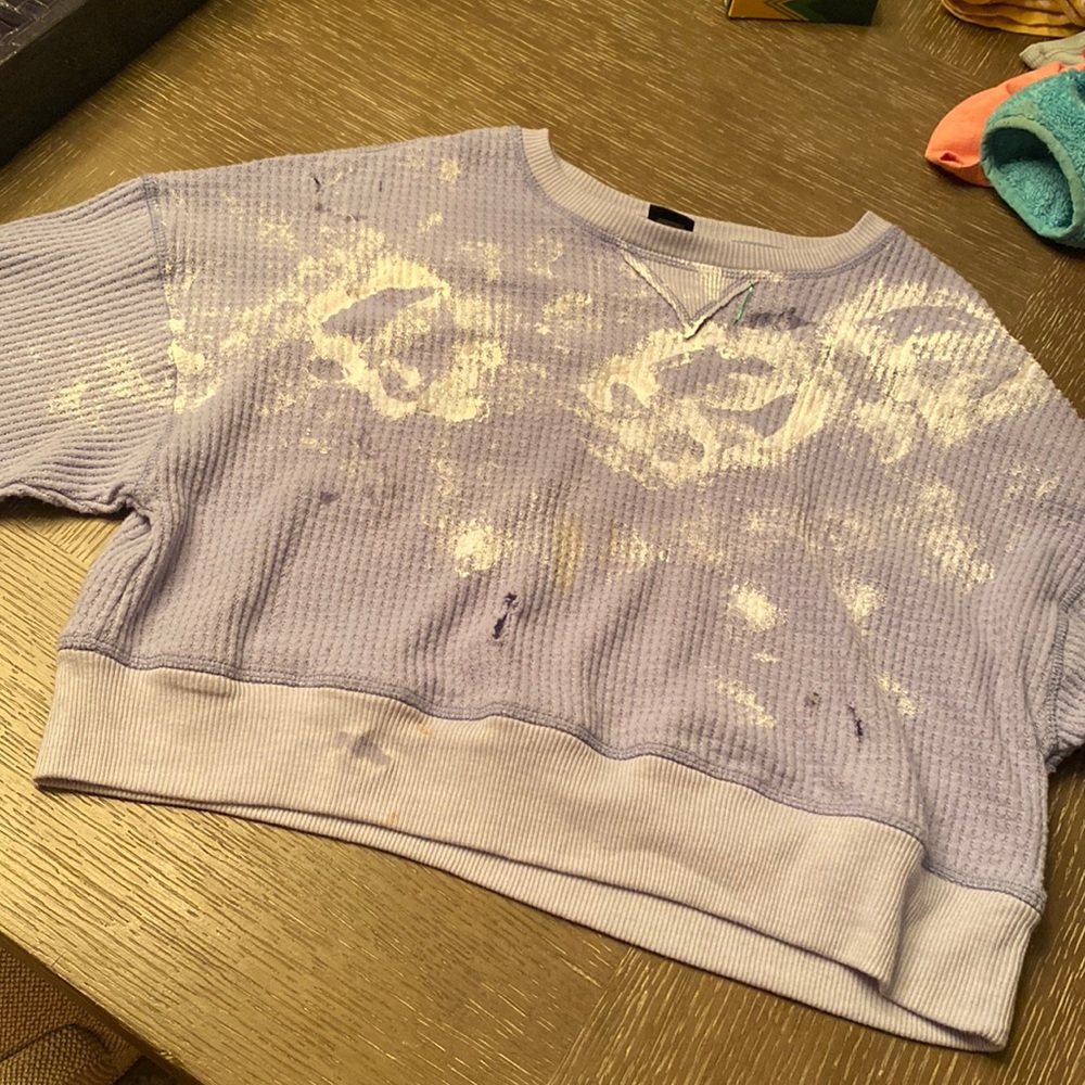 Blue sweater with reindeer paw prints